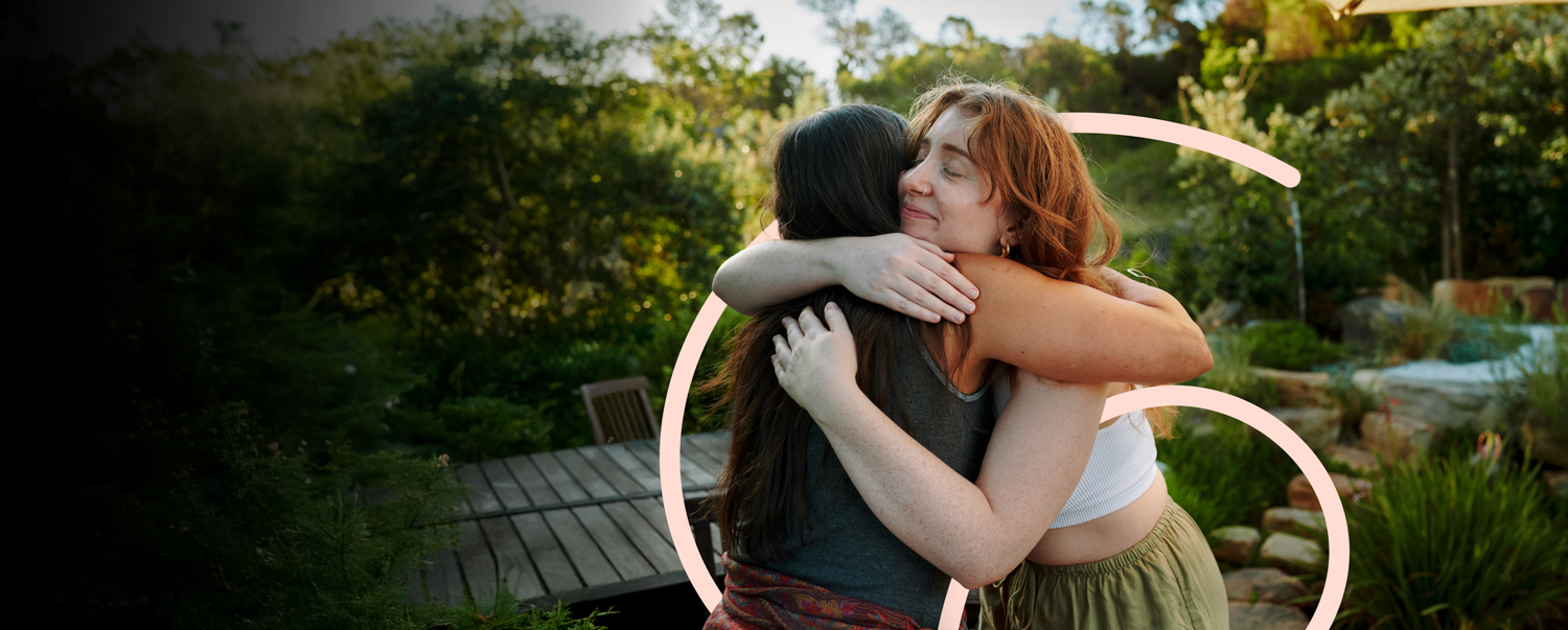 two people hugging outside
